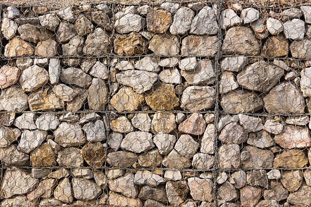 istock Stone construction with steel mesh which was dam embankment eros 511668144