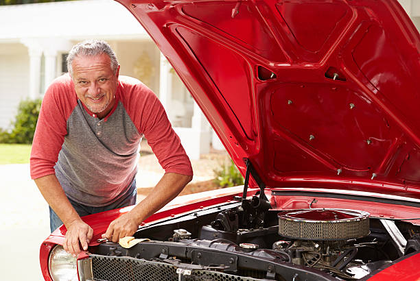 istock Retired Senior Man Working On Restored Classic Car 511669505