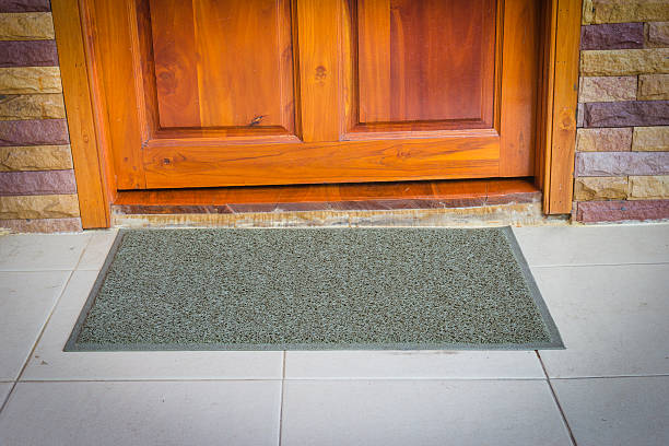 istock gray door mat  with close door 511669740
