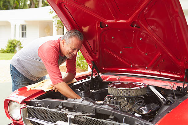 istock Retired Senior Man Working On Restored Classic Car 511669741