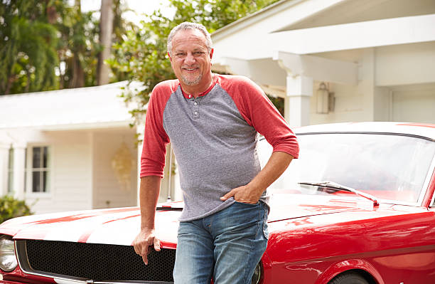 istock Retired Senior Man Standing Next To Restored Classic Car 511669835