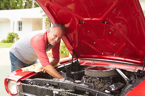 istock Retired Senior Man Working On Restored Classic Car 511669839