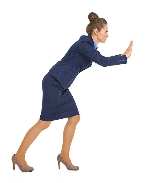 istock Business woman pushing something in front of her 511669973