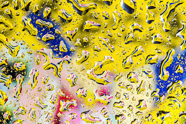 istock Yellow and blue water droplet background 511670125