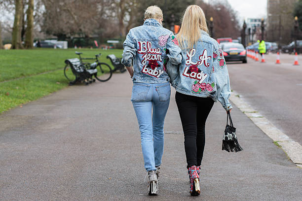 Guests after Burberry fashion show during London Fashion Week AW16 London, United Kingdom - February 22, 2016: Guests after Burberry fashion show during London Fashion Week Autumn Winter 2016. london fashion week stock pictures, royalty-free photos & images