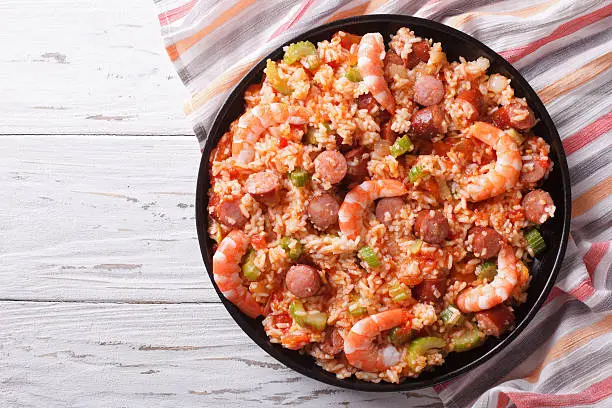 Delicious Creole jambalaya with shrimp and sausage on a plate. Horizontal top view