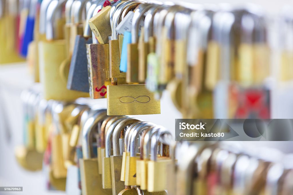 Forever love lockers. Lockers at the bridge symbolize love for ever. Lovers lock the locker on fance and throw key in river to be lost forever. Architecture Stock Photo