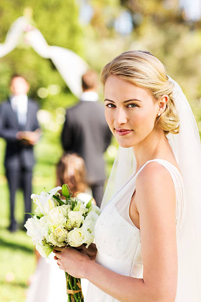 istock Bride Holding Flower Bouquet During Garden Wedding 511671013