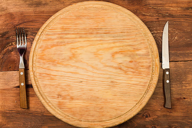 istock Round Chopping board, on wooden background 511671414