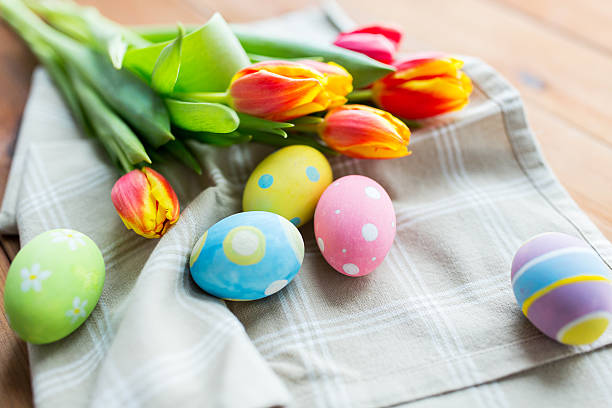 istock close up of colored easter eggs and flowers 511672920