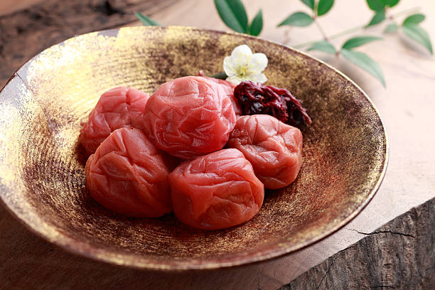 umeboshi a pickled Japanese apricot. shiso photos stock pictures, royalty-free photos & images