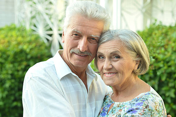 istock mature couple   in summer park 511675778