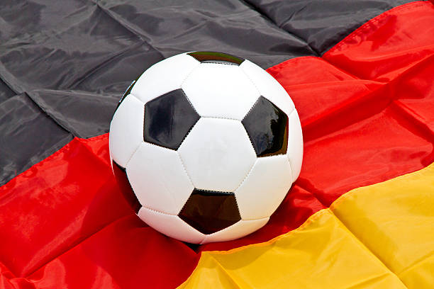 istock Soccer ball on a german flag 511675848