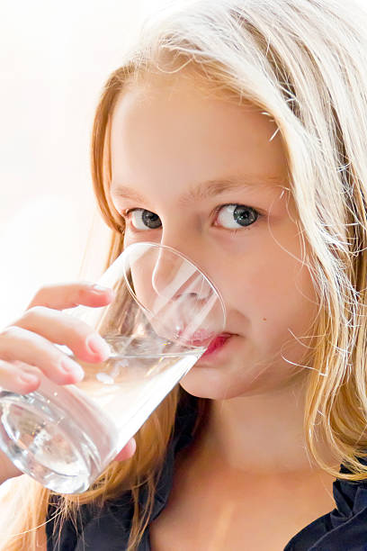 istock Caucasian girl drinking water 511678552