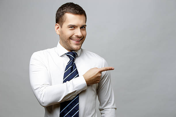 istock Handsome stylish businessman on grey background 511679442