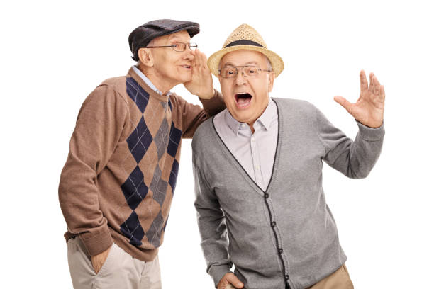 istock Senior whispering something to his friend 511679742