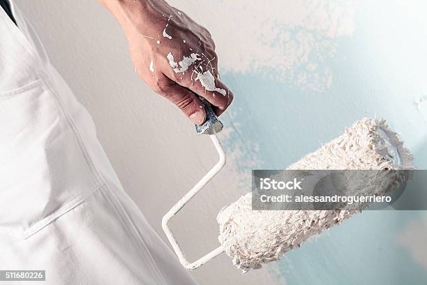 Workman Hand Holding Dirty Paintroller Stock Photo - Download Image Now - House Painter, Painting - Activity, Working
