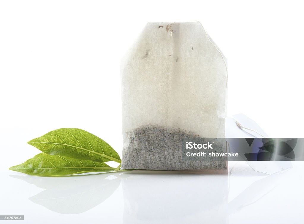 Tea bag with leaves isolated on white background Bag Stock Photo