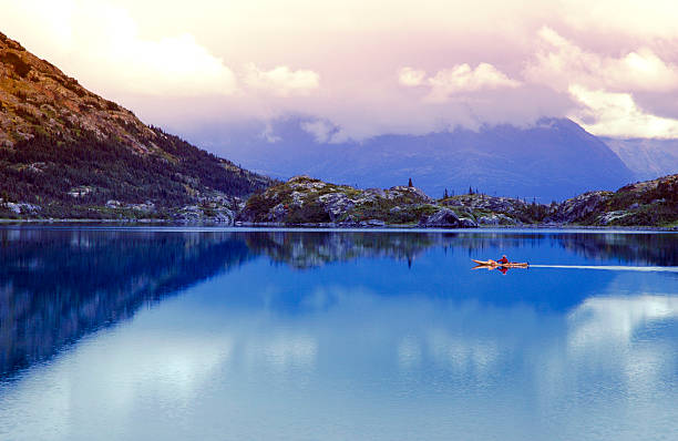 Man canoeing on Summit Lake,British Columbia,Canada.
