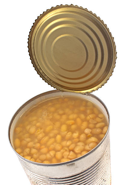 istock Open tin can of beans isolated on white 511710089