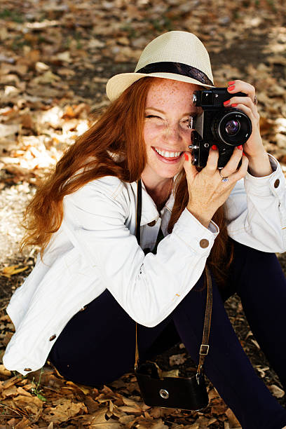 istock Nice girl photographer at work 511712363