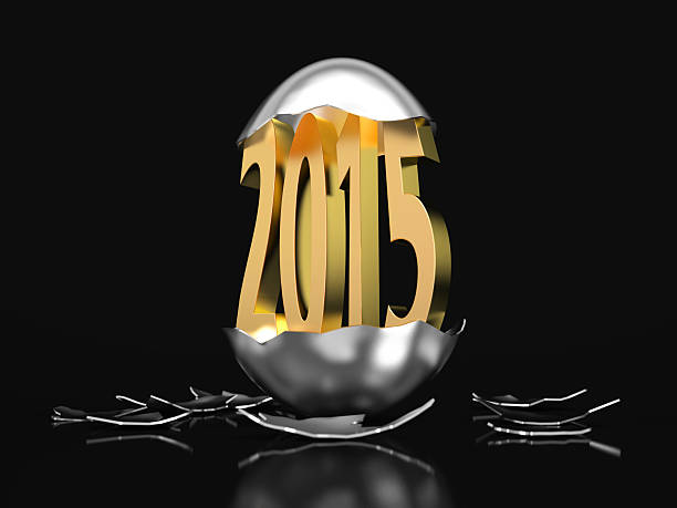 Golden 2015 hatches out of an egg stock photo