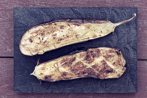 istock Grilled eggplant on wooden board, toned 511719114