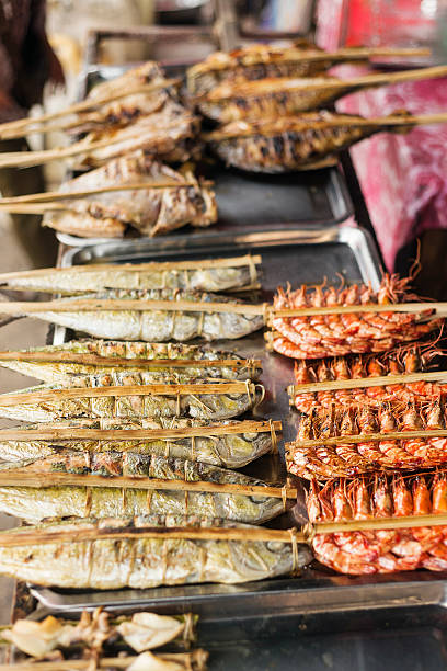 asian grilled barbecued seafood in kep market cambodia asian grilled barbecued mixed seafood in kep market cambodia kep stock pictures, royalty-free photos & images