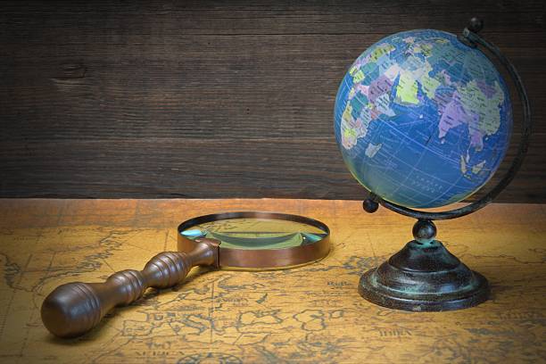 istock World Globe  And Magnifier On The Old Map 511722150