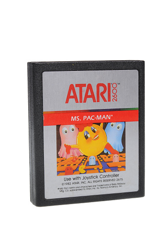 Adelaide, Australia - February 23 2016: A Studio shot of an Atari 2600 Ms. Pac-Man Game Cartridge. A popular video game from the 1980's is popular with collectors and retro gamers worldwide.