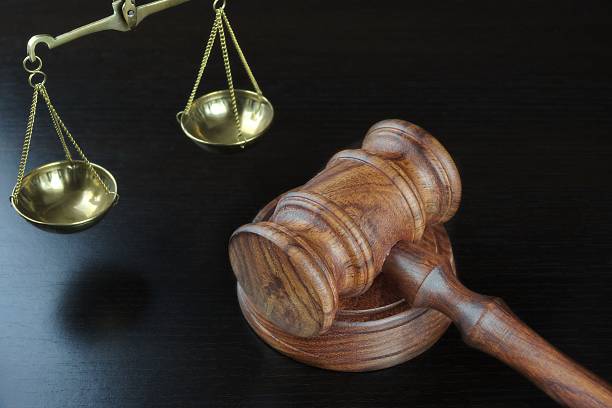 istock Judges Gavel And Scale Of Justice On The Black Table 511723032