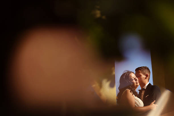 istock Bride and groom embracing outdoor 511723166