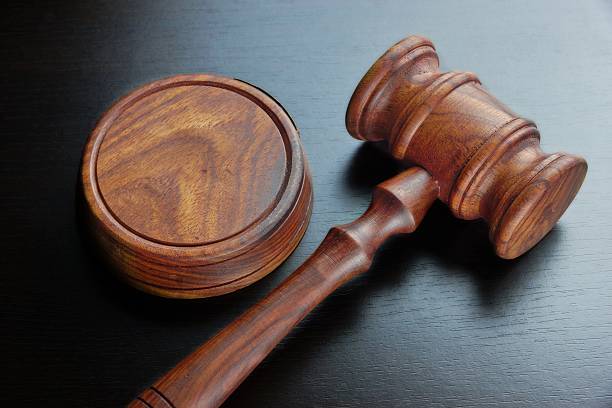 istock Judges Or Auctioneers Walnut Gavel On The Black Table 511723530