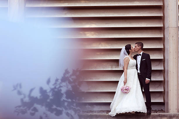 istock Bride and groom embracing outdoor 511723632