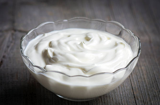 istock Greek yogurt on wooden background 511723958