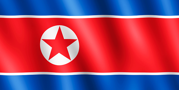 Flag of North Korea waving in the wind giving an undulating texture of folds in the fabric. The Image is in the official ratio of the flag - 1:2.