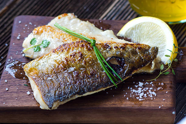 istock Fish Fillet with olive oil and lemon 511726824