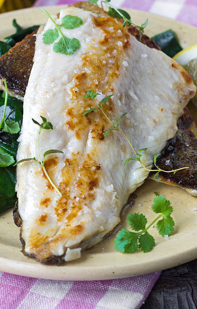 istock Fish dish -  fish fillet with chard 511727460