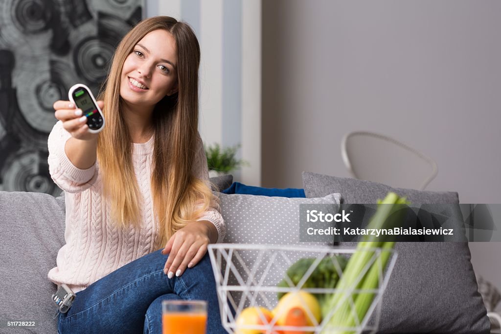 Modern diabetic girl Picture of modern diabetic girl with glucose meter Glucose Stock Photo