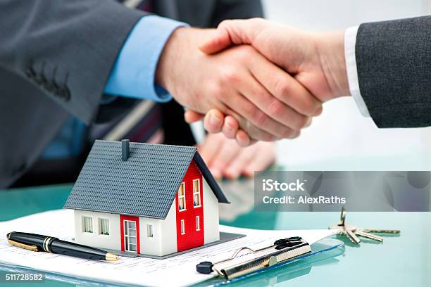 Handshakes With Customer After Contract Signature Stock Photo - Download Image Now - House, Mortgage Loan, Selling