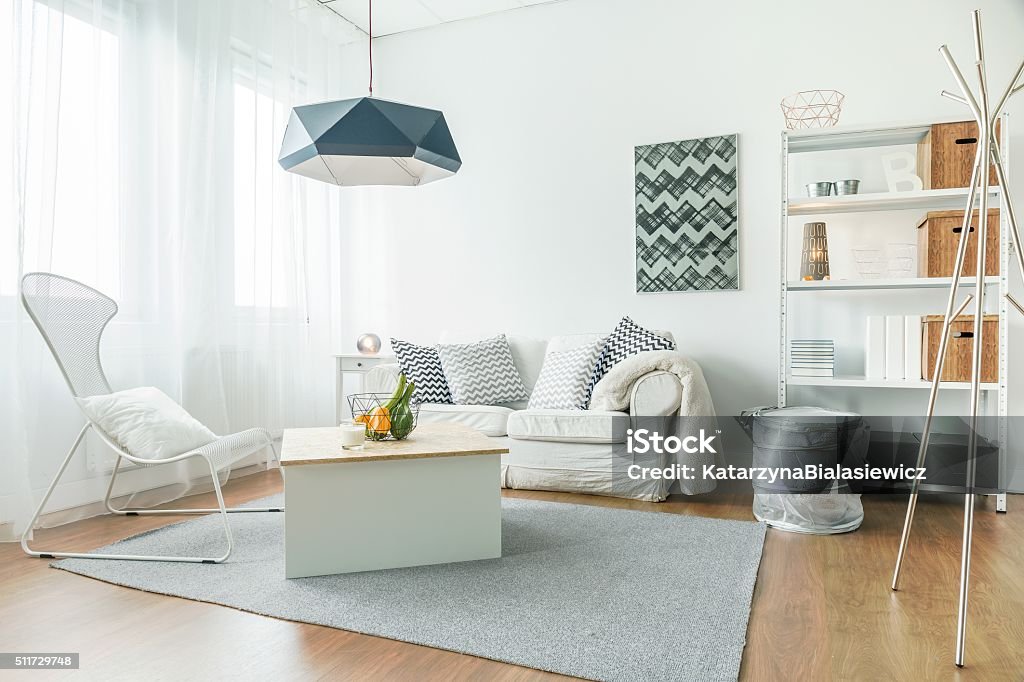 Trendy furniture in room Trendy furniture in small cozy living room Apartment Stock Photo