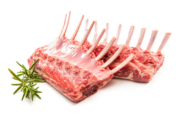 Racks of lamb Racks of lamb ready for cooking Isolated on white rack of lamb stock pictures, royalty-free photos & images