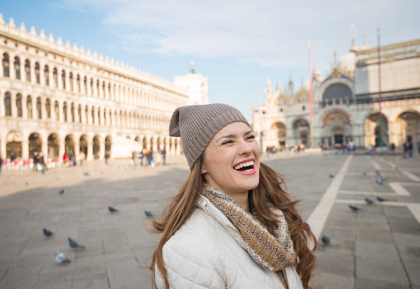 istock Laughing woman standing on Piazza San Marco 511731862