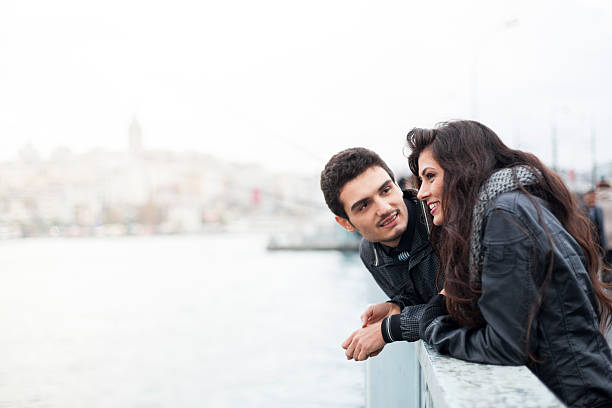 istock Friends Chatting On A City Bridge 511732774