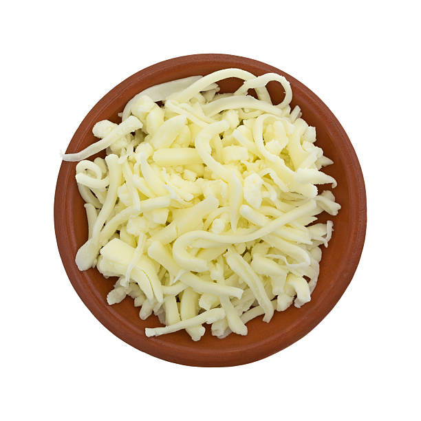 istock Pizza cheese in a small bowl on white background 511733522
