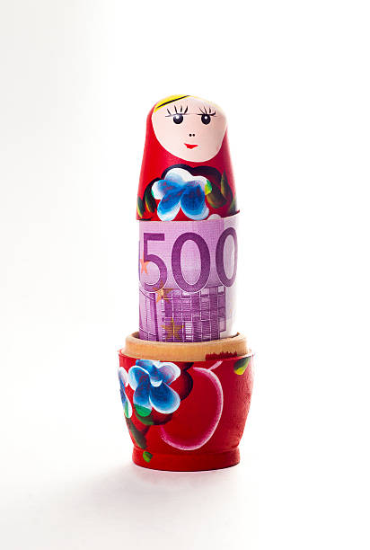 Babushka doll with 500 euro banknote inside Babushka doll with 500 euro banknote inside russian nesting doll russia doll moscow russia stock pictures, royalty-free photos & images