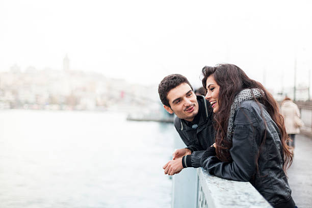 istock Young Couple On The Galata Bridge In Istanbul 511734460