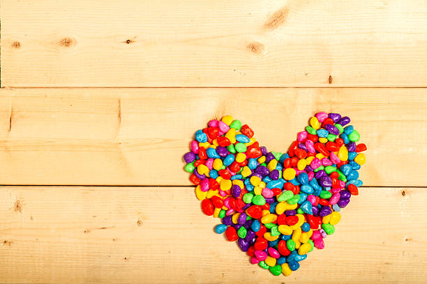 istock heart shape colorful on wooden background 511734594