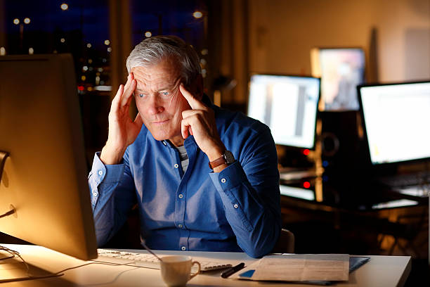 istock Exhausted businessman working late night 511736274