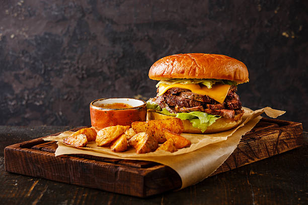 istock Pastrami Burger with sliced Roast beef and potato wedges 511737286